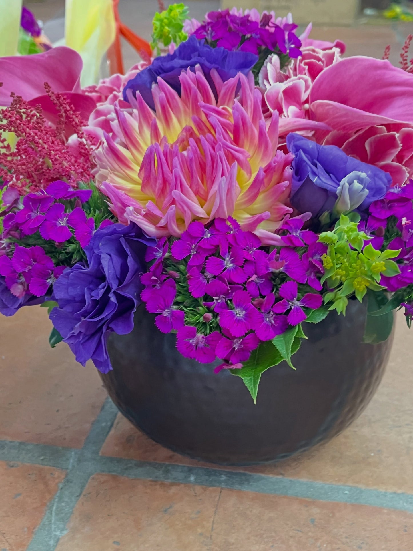Fresh arrangement made by Jerome Florists in Manhattan, compared to a wire service stock photo